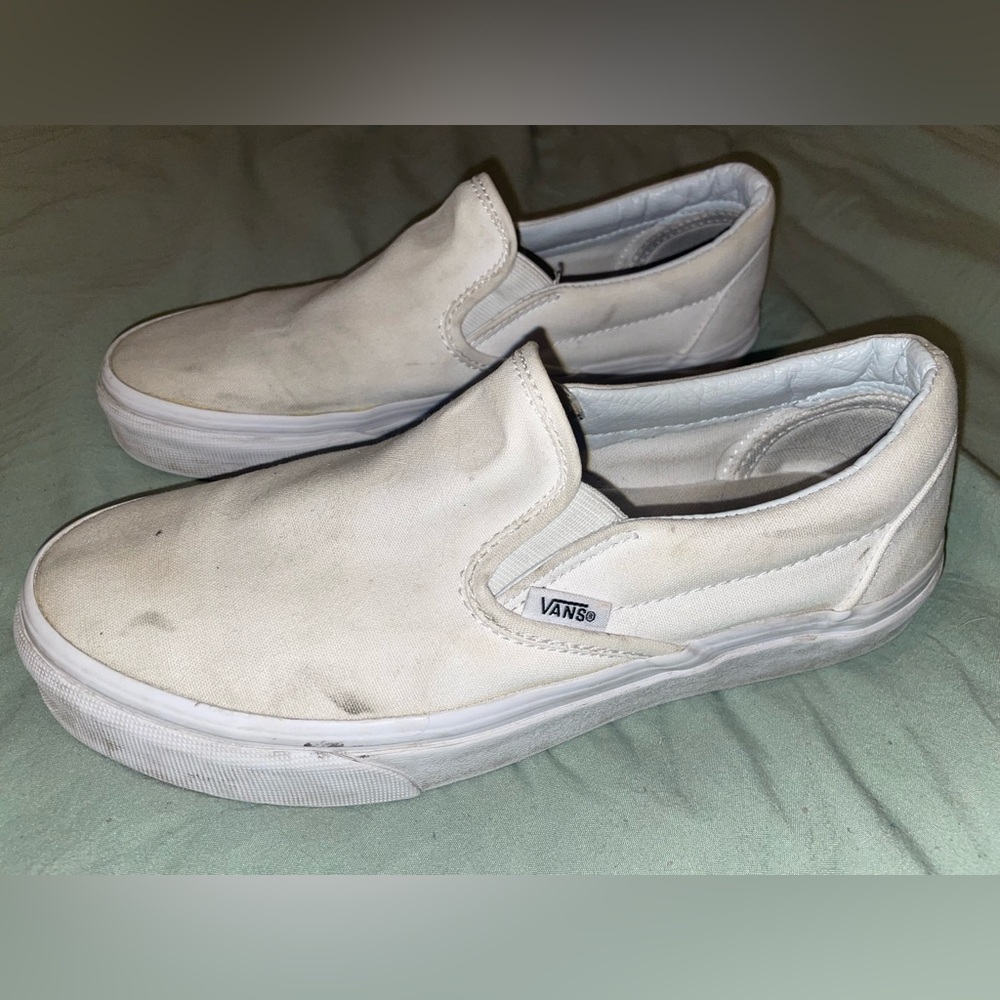 White classic Vans slip ons